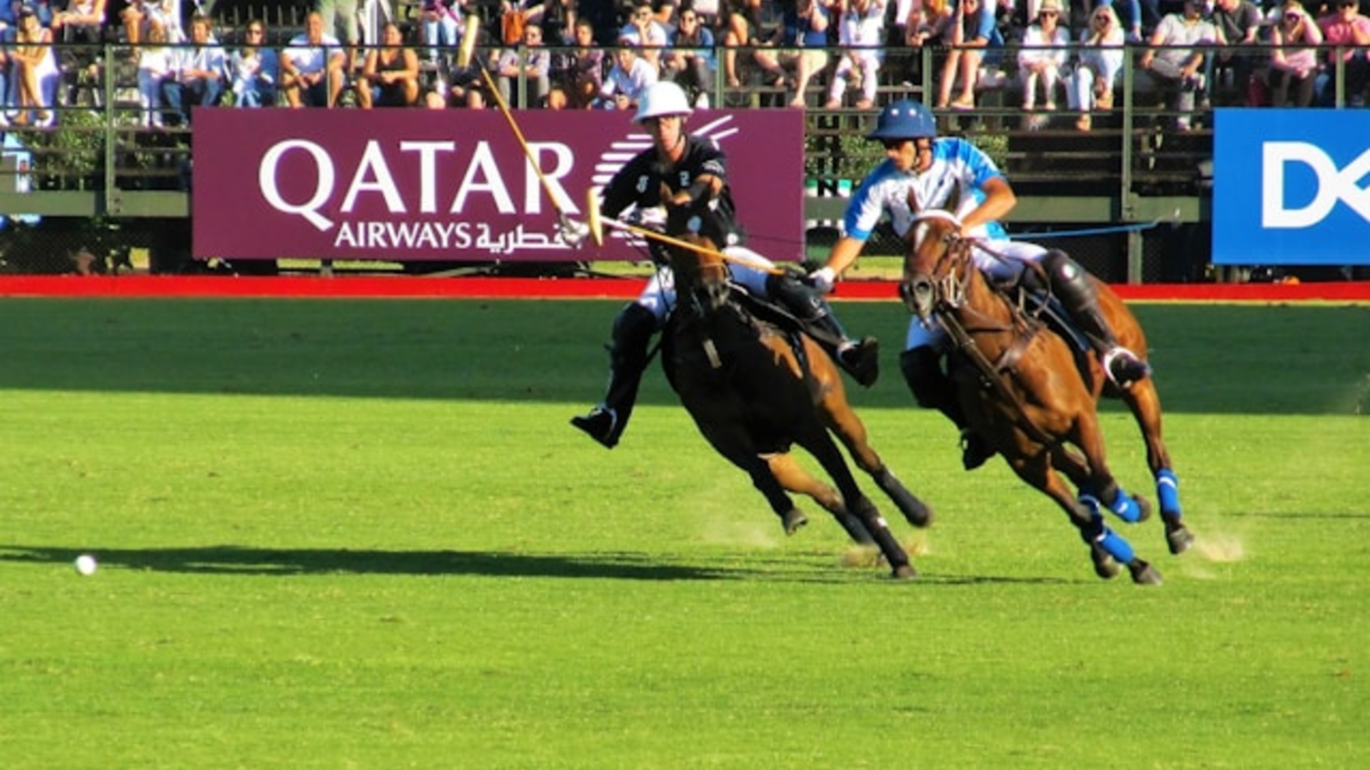 Polo is a fast-paced sport that combines horsemanship, strategy and skill. For newcomers, however, understanding the action can be difficult because players move quickly and many of the rules are not obvious. In this guide to polo rules explained, you'll learn how the game works, from chukkas and scoring to the right of way and common fouls.

## How Many Players Are in a Polo Game?

Polo is played by two teams of four riders, each player taking in a specific role. Numbers 1 and 2 are the team's attacking players. Number 3 is usually the team's key strategist and strongest hitter, while Number 4 plays primarily in defense. However, these roles can be changed during the actual game, if it helps the team.

Two mounted umpires oversee the action and make decisions during the game. If they disagree on a decision, a referee can be consulted to settle the matter.

## What Are Polo Chukkas and How They Work?

A polo match is divided into periods called chukkas, each lasting up to seven and a half minutes. Most matches have four to six chukkas, depending on the competition.

There is a short break between chukkas, giving players time to change horses and rest. Because polo is physically, players change their horses with rested ones after each chukka, to maintain their advantage. Elite riders can ride up to 8 horses in a single match.

At halftime, spectators are traditionally invited onto the field to replace the divots made by the horses' hooves.

A bell sounds after seven minutes to signal the end of a chukka. If the ball remains in play, the chukka continues until play stops or a second bell sounds 30 seconds later.

## How Does Polo Scoring Work?

Polo scoring is straightforward: a team scores a goal when the ball passes completely between the goalposts. The team with the most goals at the end of the match wins.

After every goal, the teams change ends before play restarts. This helps balance any advantage caused by the condition of the field, wind or other factors.

## What Is the Right of Way in Polo?

One of the most important polo rules is the right of way. It determines which player has priority when two or more players compete for the ball and helps prevent dangerous collisions.

When a player hits the ball, an imaginary line is drawn along its path. Known as the line of the ball, it helps establish the direction of play. A player riding along this line generally has priority, while opponents must not cross it in a way that creates danger or interferes with the player who has the right of way.

## Which Moves Are Legal in Polo?

Some actions that look aggressive to newcomers are actually legal parts of the game, such as riding off and hooking.

Riding off involves using your horse to push an opponent and their pony away from the ball. It is allowed when performed safely and at an appropriate angle.

Hooking involves using your mallet to prevent an opponent from hitting the ball. It is permitted when performed from a legal position and without endangering the horse or rider.

## What Are the Main Polo Fouls?

Riding off and hooking can become polo fouls when performed dangerously or illegally. Other common fouls include crossing the line of the ball in a dangerous way or interfering with a player who has the right of way.

When an umpire sees a foul, they blow the whistle and stop play. The opposing team is usually awarded a penalty hit. The type of penalty depends on the nature and location of the foul and can range from a free hit from a set position to a direct shot at goal.

Understanding these basic polo rules makes the game much easier to follow. Once you know what to watch for, the fast-moving action becomes less chaotic and much more enjoyable to watch.