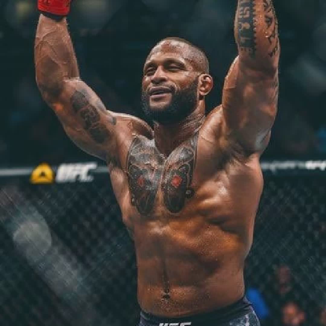 Post by Emmanuel Ikwaibom: A triumphant MMA fighter raises his fists in victory inside the octagon after a fight. #buzzer #Daily #sports #viral...