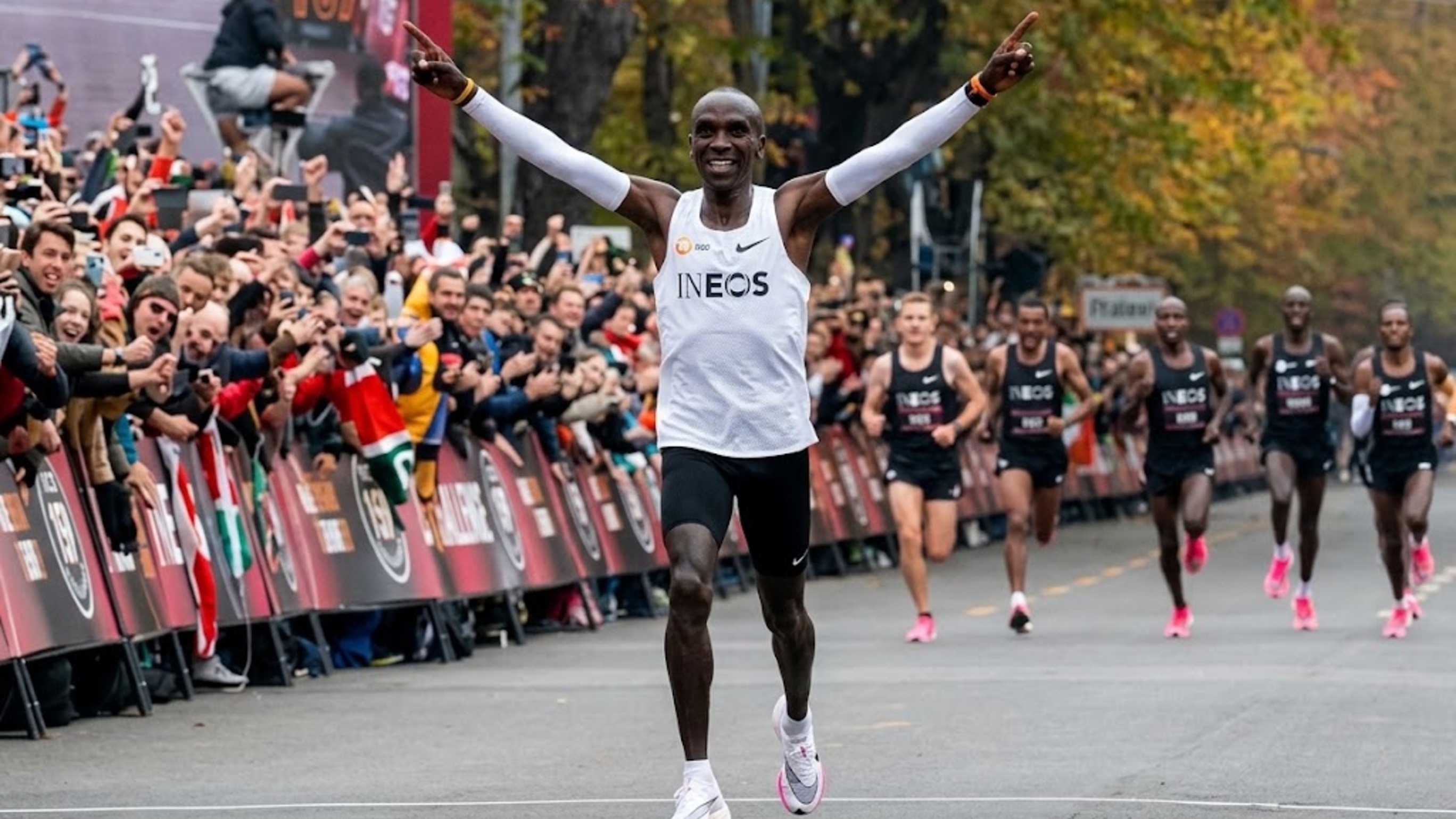 The marathon distance has been fixed at 26.2 miles since 1921. The times elite runners cover that exact distance in keep dropping anyway, repeatedly, across both the men's and women's fields, decade after decade.
That's a genuinely interesting puzzle: a sporting distance that hasn't budged, producing results that keep improving as though the course itself were somehow getting shorter.
## Why shoe technology gets most of the credit, and deserves some of it
Carbon-plated racing shoes, which became widely available in the late 2010s, introduced a genuine, measurable propulsive advantage over previous shoe designs, one that independent studies have estimated saves runners several percentage points in running economy. That's a real, physics-based explanation for at least part of the recent wave of faster times, and it's the factor most casual fans point to first.
It's not, however, the whole story. Records were falling before this specific shoe technology existed too, just at a somewhat slower rate.
## Why training science has quietly closed a different gap
Elite marathon training has grown significantly more sophisticated over the past two decades, with individualized altitude training protocols, more precise nutrition and hydration strategies during races, and recovery techniques that let athletes sustain higher training volumes without breaking down. None of that shows up as dramatically as a new shoe, but the cumulative effect on an athlete's underlying fitness is genuinely significant.
That's the less visible half of the equation: athletes arriving at the start line with a higher baseline fitness than equivalent athletes a decade or two earlier, independent of anything happening on their feet.
## Why professionalization and depth matter as much as any single innovation
The marathon has become a genuinely more professionalized sport globally, with more full-time elite athletes, more prize money at major races, and a deeper overall competitive field than existed a generation ago. Deeper fields produce faster times structurally, since a larger group of elite runners sharing pacing duties can sustain a quicker collective pace than any single dominant runner managing the effort alone.
That depth effect compounds with the technology and training improvements rather than operating separately from them, making it difficult to isolate any single factor as the primary driver.
## Why course design and race organization play a role too
Major marathon organizers have increasingly optimized courses and pacing strategies specifically to support fast times, from flatter, more direct routes to professional pacemakers deployed specifically to help elite fields hit optimal splits. That's a deliberate choice by race organizers, not a natural byproduct of the sport, and it reflects how much major marathons now compete with each other for the prestige of hosting record-breaking performances.
The distance hasn't changed in over a century, but nearly everything around it, the shoes, the training, the depth of competition, and the races themselves, has. Which of those factors do you think matters most, and is there a limit to how much further times can fall before human physiology itself becomes the binding constraint?
