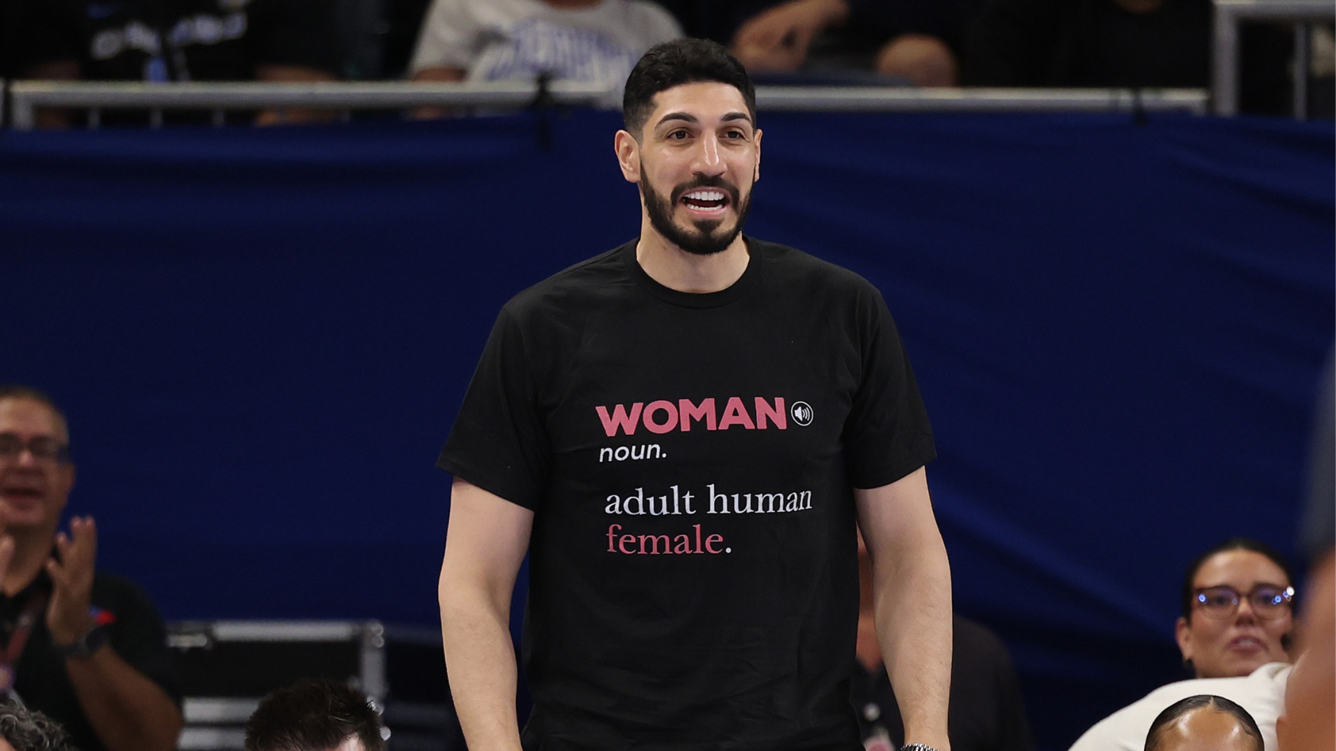 **A confrontation that lasted maybe thirty seconds courtside has turned into a genuine institutional crisis for the Chicago Sky, and the questions it's raising go well beyond one bad afternoon at Wintrust Arena.**

Here's what actually happened.

Former NBA player Enes Kanter Freedom attended Sunday's Chicago Sky game against the Indiana Fever wearing a shirt reading "WOMAN noun. adult human female," inserting himself directly into the broader national debate over eligibility rules in women's sports.

During the third quarter, he began trash-talking Sky guard Natasha Cloud from courtside, according to Sky owner Michael Alter's own account of reviewing the incident.

Cloud eventually walked toward him and confronted him directly.

Kanter Freedom stood up, arms outstretched, took steps toward the court, and security removed him from the arena entirely.

## The ban

Two days later, Alter banned him from Wintrust Arena indefinitely, telling reporters Kanter Freedom had "demonstrated to us, unequivocally, that he has the potential to be a threat," and that the ban would stand "unless sometime in the future, he's able to prove to us that he's able to abide by our rules."

Alter also confirmed the team hadn't actually invited Kanter Freedom to the game and wasn't aware he was attending until roughly three hours before tip-off, having received a text from his manager to a Sky staffer who happened to have a prior working relationship with him.

Strip away the politics for a second and just look at the operational problem this creates for a franchise.

A team now has to make real-time security and access decisions about a former professional athlete who has stated publicly, repeatedly, on national television, that he intends to keep showing up to WNBA games, including buying tickets under someone else's name specifically so they can't be canceled.

That's not a hypothetical policy question anymore. That's an active, ongoing logistics and safety headache for arena operators every single time this player's team is playing at home.

## A fraught moment for the league

This also lands inside a genuinely fraught moment for the league more broadly.

The same week, the Sky said they were reviewing an incident where objects were thrown onto the court during a separate game against Golden State.

Kanter Freedom himself had drawn attention weeks earlier by formally declaring for the WNBA draft as part of his broader campaign around the league's eligibility rules, even though sources indicate he isn't actually WNBA-eligible.

Whatever anyone thinks about the underlying debate over league eligibility rules, and that's a genuinely contested political and cultural question people can reasonably disagree about, the actual operational question facing WNBA franchises right now is much narrower and more urgent.

At what point does a league or a specific franchise stop treating provocative fan or spectator behavior as a one-off incident and start treating it as a recurring security and access management problem that needs its own dedicated policy?

Where's the actual line between a fan expressing a controversial opinion at a game and a fan whose presence itself becomes a legitimate operational risk for a franchise?