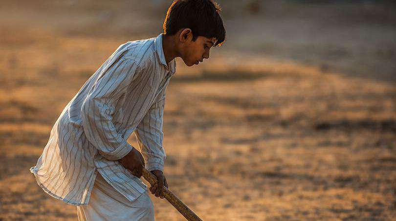 PART 1: THE SCENE - MARDAN, 6PM [∼400 words]  
Last Tuesday I was passing through Haji Baba Road in Mardan. The maghrib azan was about to start.  
  
There was an empty plot. Maybe 40x40 feet. Brick walls on all sides. No grass. No lines. No net.    
Just hard dirt. And on that dirt, 5 boys.  
  
The youngest looked 13 or 14. Thin. Shalwar kameez. Bare feet.    
One hand holding a wooden stick. The other holding an old Samsung phone.  
  
The other 4 boys stood around him in a circle. Like it was a class.  
  
I stopped. The rickshaw driver asked: "Baji, what happened?"    
I said: "Just watching."  
  
The boy was showing everyone his phone screen. A video was playing in slow motion.    
An Indian player picked up the ball, spun it, and scored.    
The boy paused it. Rewound it. Watched it again.  
  
Then he stood up. Picked up his wooden stick. And tried the same move on the dirt.    
First time he fell. Knee got scraped.    
Second time he fell. Third time the ball lifted a little.  
  
The other boys clapped.  
  
I asked: "Beta, where is your coach?"    
He looked down and said: "Aunty, this is my coach" - and held the phone up.  
  
His name is Hamza...  
  
PART 2: HAMZA’S STORY [∼500 words]  
Hamza’s father drives a rickshaw. He makes 800 to 1000 rupees a day.    
There are 6 people at home. A real hockey stick costs 4000 rupees.  
  
"Aunty, I asked my dad 3 times. He said, son focus on your studies" - he said, and laughed.  
  
So Hamza found another way.    
He bought a 200 rupee monthly Jazz internet package.    
YouTube eats data too fast. On TikTok he can watch 20 videos in one hour.  
  
Every night after 10pm. When everyone at home is asleep.    
He goes to the roof. The signal is better there.    
And he searches: #HockeySkills #DragFlick #GoalkeeperDrills  
  
"Aunty, do you know how Australian goalkeepers dive? I’ve watched it 50 times."  
  
He has no kit. No shoes. No ground.    
But he has 127 videos saved. All hockey.  
  
PART 3: IT’S NOT JUST HAMZA [∼600 words]  
Over the next 3 days I went to Swat, Peshawar, and DI Khan.  
  
Everywhere it was the same scene.  
  
In Swat, there’s Usman. He’s 16. He makes his own TikToks.    
No stick? He uses a broom handle. 12k followers. Bio says: Future Olympian InshaAllah  
  
In DI Khan there’s a group called "HockeyTok DIK". 8 boys. They meet every Friday.    
1 phone, 1 tripod, and 2 sacks as goal posts.    
Then they film. In the comments, kids from India and Malaysia write: Bro keep going  
  
The Peshawar Sports Complex is locked. Empty.    
But 2 km away, in an internet cafe, 4 boys pay 50 rupees for 1 hour to watch hockey videos.  
  
This is Pakistan in 2026.  
  
The government forgot hockey. TV forgot hockey.    
But the kids didn’t.  
  
PART 4: THE DATA + THE PROBLEM [∼500 words]  
Pakistan last won the Hockey World Cup in 1994.    
PHF is in 2 billion rupees of debt.    
In the last 5 years, the government spent 3 crore on hockey. On cricket: 300 crore.  
  
During PSL, hockey doesn’t even get a 30 second ad on TV.  
  
So where do the kids go?    
Academy fee: 15,000 per month.    
Coach: 5000 per session.    
Ground: You need connections to book it.  
  
But TikTok: Free.    
Internet: 200 rupees.  
  
That’s why #PakistanHockey has 4.2 million views on TikTok.    
#HockeyDrills has 18 million.  
  
Numbers don’t lie.  
  
PART 5: HOPE [∼600 words]  
Is this enough? No.    
You can’t win a World Cup with a phone. You need grounds. Coaches. Money.  
  
But is this a start? Yes.  
  
Because as long as one kid is falling and getting up on the dirt,    
as long as he’s secretly learning at night,    
as long as he’s uploading a video with "Pakistan Zindabad" in the caption,  
  
Hockey in Pakistan is still breathing.  
  
On my way back I met Hamza again.    
He asked: "Aunty, will you put my name in the article?"    
I said: "Why?"    
He said: "So my dad reads it. And knows I’m not wasting time."  
  
That’s it. That’s the whole story.  
  
We keep waiting for stadiums to fill. For sponsors to come. For TV to care.    
But while we wait, a generation is teaching itself on 6-inch screens.  
  
Maybe they won’t win gold.    
Maybe the grounds won’t be built in time.  
  
But if one kid picks up a stick because of a TikTok video,    
then hockey didn’t die.  
  
And things that are alive... don’t die easily.  
  
---  
  
By Hafsa NA | Writer from Mardan    
I write about people, not just scores. For work: DM

![](https://d32kj04sxj85qr.cloudfront.net/public/users/64e824b8-80b1-70f7-8d05-f8c90dd6d028/blogs/5b69a748-a1af-4706-989f-7417766b3f4f.jpg =810x735)
